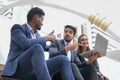 multiracial business people in suit working with laptop on site outdoors Royalty Free Stock Photo