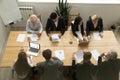 Multiracial business people working together at conference table Royalty Free Stock Photo