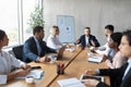 Multiracial Business Team Having Corporate Meeting Sitting In Modern Office Royalty Free Stock Photo