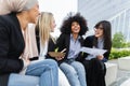 Multiracial business women taking a break eating a meal Royalty Free Stock Photo