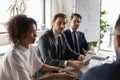 Multiethnic businesspeople brainstorm at meeting in office boardroom Royalty Free Stock Photo