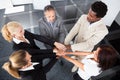 Multiracial businesspeople stacking hands Royalty Free Stock Photo