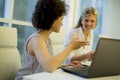 Multiracial businesswomen on meeting in office brainstorming, working on laptop