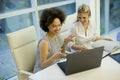 Multiracial businesswomen on meeting in office brainstorming, working on laptop