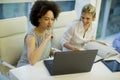 Multiracial businesswomen on meeting in office brainstorming, working on laptop