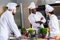 Multiracial chefs team discussing new recipe Royalty Free Stock Photo