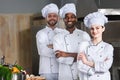 Multiracial chefs team posing with folded arms Royalty Free Stock Photo