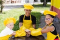 Multiracial children cook touching hands together forming pile. Friendship of multinational kids. Childhood. cooks in