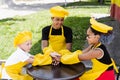 Multiracial children cook touching hands together forming pile. Friendship of multinational kids. Childhood. cooks in