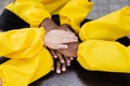 Multiracial children hands together forming pile close-up. Friendship of multinational kids. Childhood.