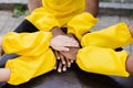 Multiracial children hands together forming pile close-up. Friendship of multinational kids. Childhood.