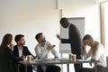 Multiracial colleagues argue at company meeting in office Royalty Free Stock Photo