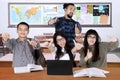 Multiracial college students with thumbs up Royalty Free Stock Photo
