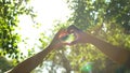 Multiracial couple hands in heart shape, interracial friendship, love and care