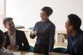 Multiracial diverse employee laugh talking discussing ideas at meeting Royalty Free Stock Photo