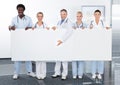 Multiracial Doctors Holding Placard Royalty Free Stock Photo