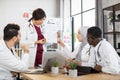 Multiracial doctors using gadgets during consilium Royalty Free Stock Photo