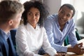 Multiracial employees brainstorm negotiating at office meeting Royalty Free Stock Photo