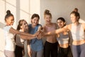 Multiracial happy girls have motivational training at workout