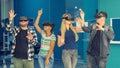 Multiracial friends group playing on vr glasses indoors. Virtual reality concept with young people having fun together.