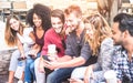 Multiracial friends group using mobile smart phone at university college Royalty Free Stock Photo