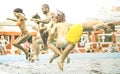 Multiracial friends having fun jumping at swimming pool party aquapark Royalty Free Stock Photo