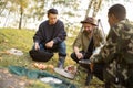 Multiracial friends having a picnic on fishing