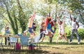 Multiracial friends jumping at barbecue pic nic garden party - Friendship multicultural concept with young happy people having fun