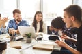 Multiracial friends studying at campus library together Royalty Free Stock Photo