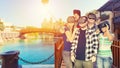 Multiracial friends with vr glasses taking selfie outdoor - Concept of virtual reality travel around the world with young people Royalty Free Stock Photo