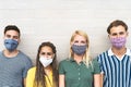 Multiracial friends wearing face mask for preventing and stop corona virus spread Royalty Free Stock Photo