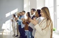 Multiracial group of business people clapping hands to congratulate their boss - Business company team, standing ovation Royalty Free Stock Photo