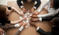 Multiracial group of colleagues engaging in assembling puzzle, t Royalty Free Stock Photo