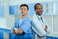 Multiracial group of doctors in medical uniforms in clinic Royalty Free Stock Photo