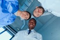Multiracial group of doctors standing in circle in clinic Royalty Free Stock Photo