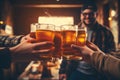 Multiracial group of friends enjoying a beer - Young people hands toasting and cheering aperitif beers half pint - Friendship and