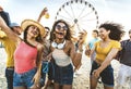 Multiracial group of friends having fun dancing on the beach - Happy people enjoying music festival on weekend vacation Royalty Free Stock Photo