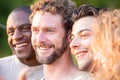 Multiracial group of friends having fun together on city street - Millenial people laughing hugging outside - Friendship Royalty Free Stock Photo