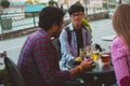 Multiracial group of friends having lunch together