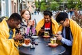 Multiracial group of friends having lunch together Royalty Free Stock Photo