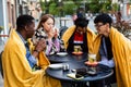 Multiracial group of friends having lunch together