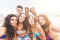 Multiracial group of friends taking selfie on the beach Royalty Free Stock Photo