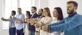 Happy diverse dream team standing in office, smiling and showing thumbs up together Royalty Free Stock Photo