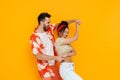 Multiracial happy couple dancing while making fun together Royalty Free Stock Photo