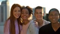 Multiracial high school pupils smiling camera, hugging friends togetherness