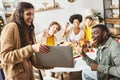 multiracial jolly relatives sitting at Christmas