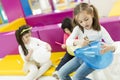 Multiracial liitle girls at playroom Royalty Free Stock Photo