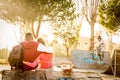 Multiracial love couple at skate park with music and biker