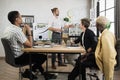 Multiracial male business people having briefing about financial situation at company. Royalty Free Stock Photo