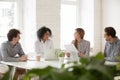 Multiracial male and female colleagues having discussion at team Royalty Free Stock Photo